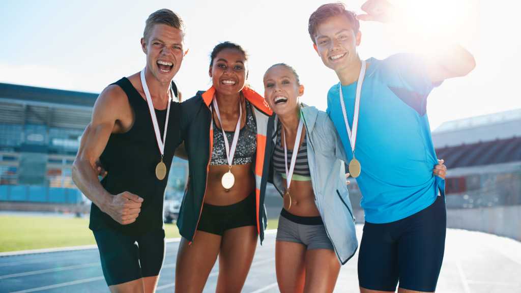 Track athletes celebrating achievement representing athletes with autism succeeding in sports