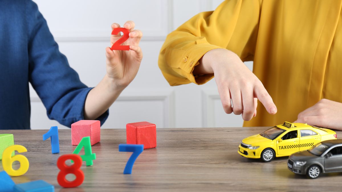 Blog 5 a registered behavior technician helps teach a child colors via play