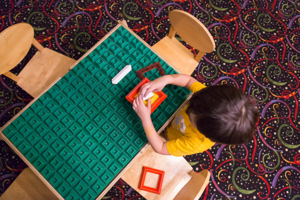 Child in a ABA Therapy sitting at a table