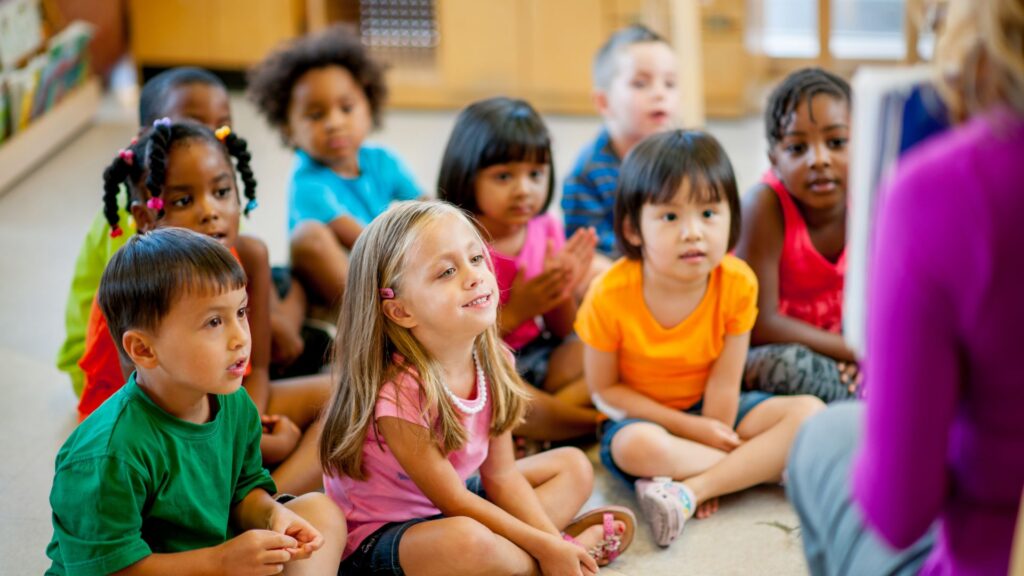 Group of preschool-aged children participating in a classroom activity