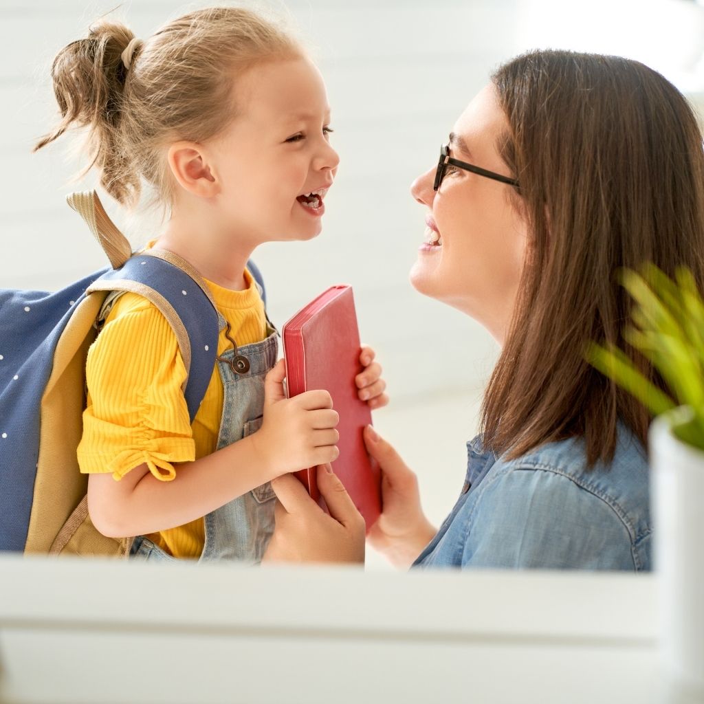 Parent supporting a young child during an everyday routine