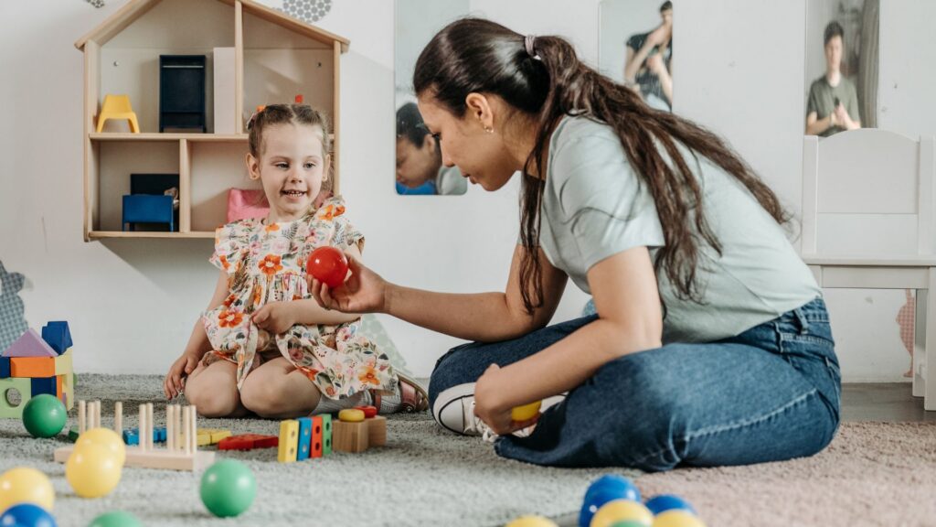 Child practicing skills through play with an adult